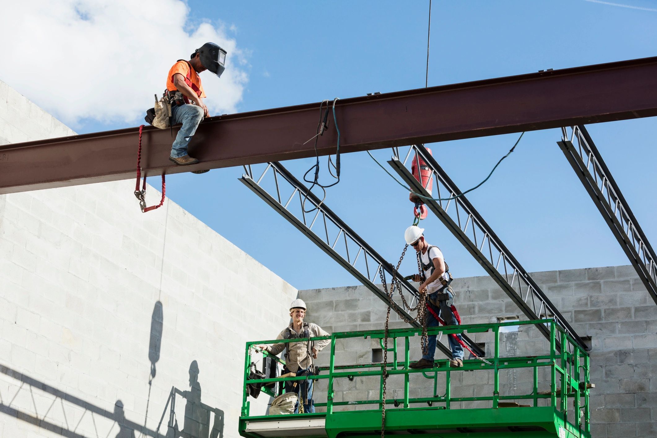 Construction crew installing structural framing at a jobsite