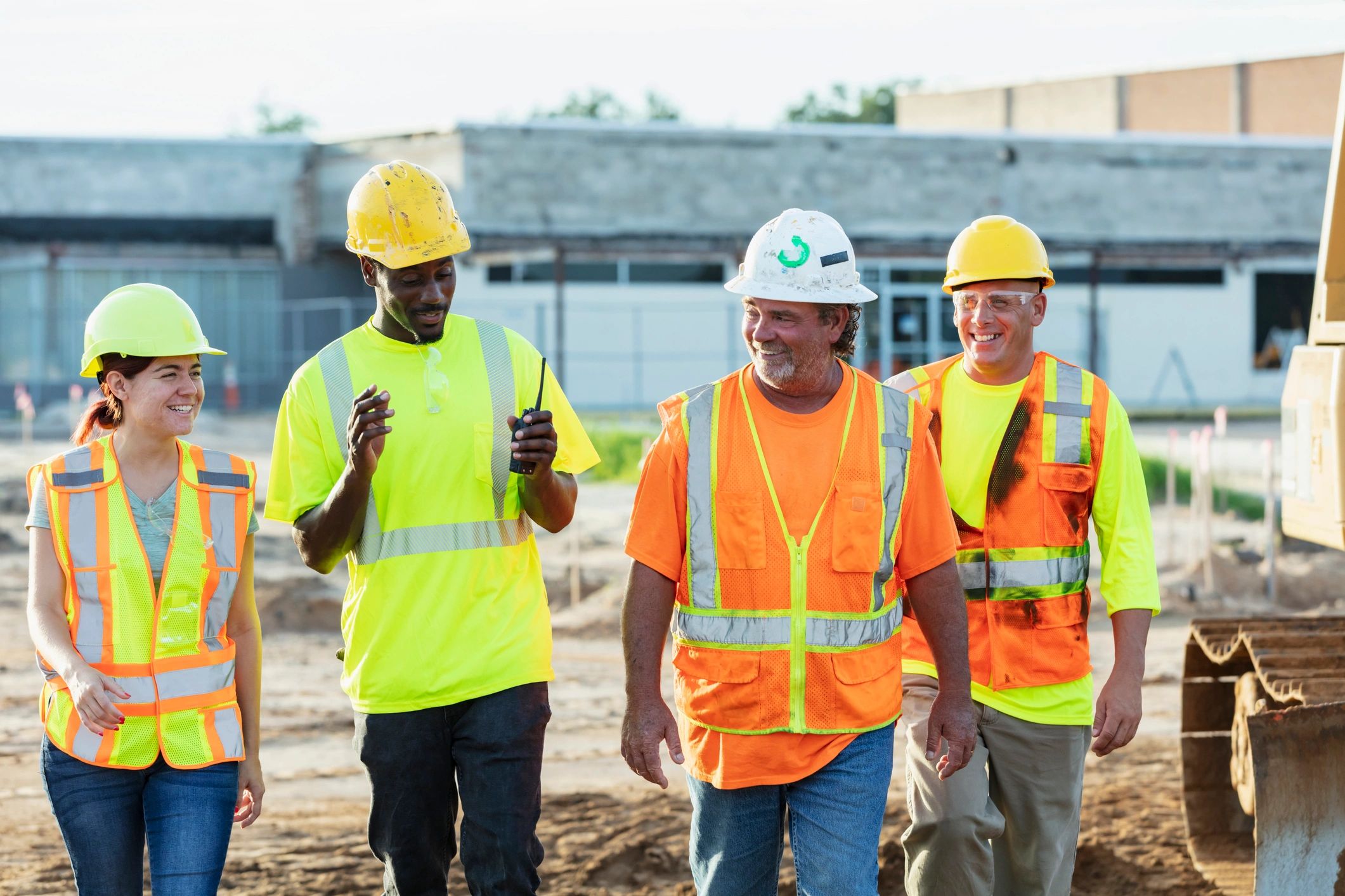 Commercial construction team walking a job site