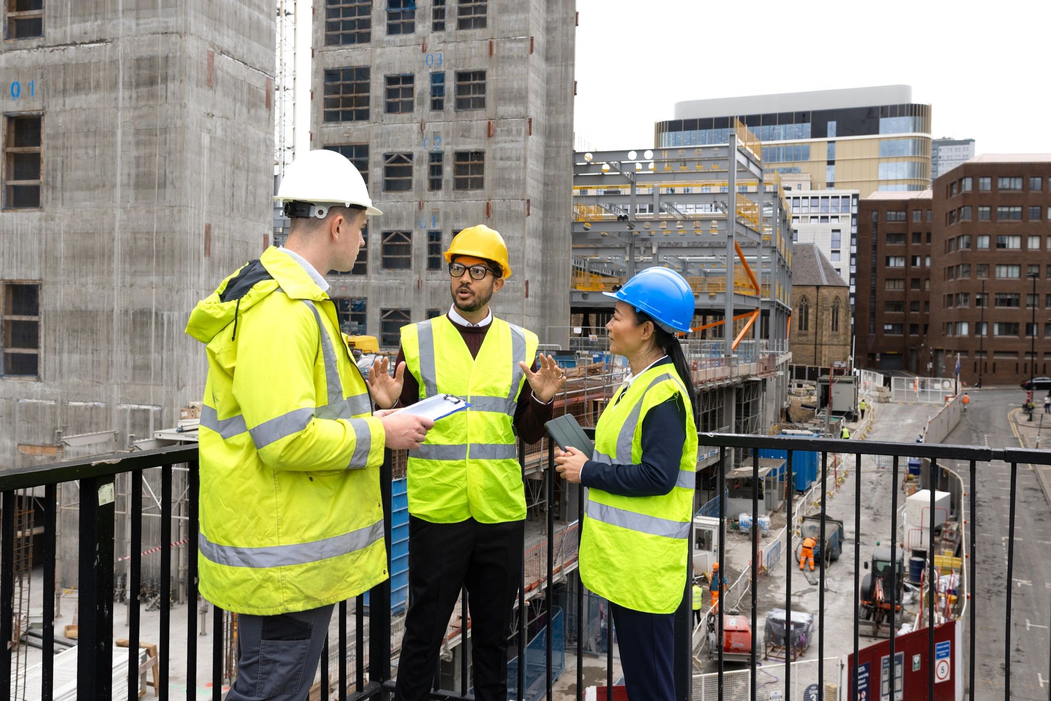 Construction team reviewing blueprints on a jobsite